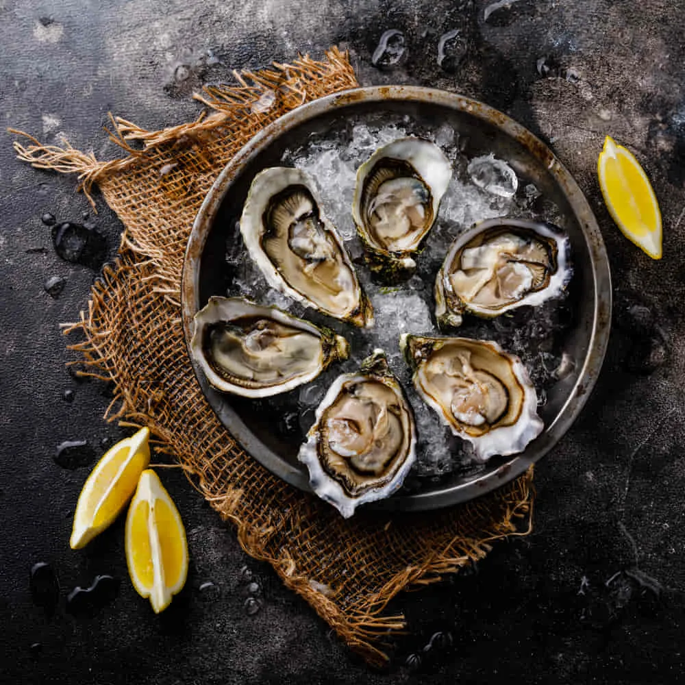 Open Shucked Fresh Oysters With Lemon On Ice On Da 2021 10 21 04 01 53 Utc, Franks Seafood